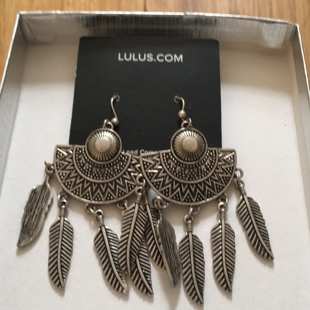Lulu’s faux silver feather earrings